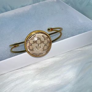 Gold cuff bangle